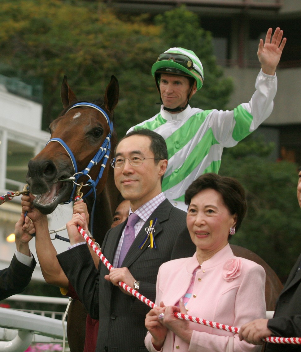 Horse enthusiast Henry Tang, with his mother in 2006, after his horse Disguise, ridden by Glyn Schofield, won a race at Sha Tin. Photo: Kenneth Chan