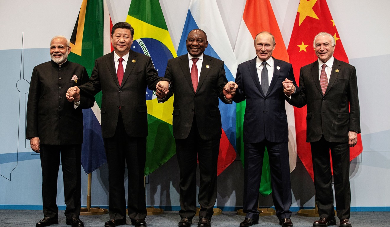 India’s Prime Minister Narendra Modi, China’s President Xi Jinping, South Africa’s President Cyril Ramaphosa, Russia’s President Vladimir Putin and Brazil’s President Michel Temer pose for a group picture during the 10th BRICS (Brazil, Russia, India, China and South Africa) summit on July 26 in Johannesburg, South Africa. Financial markets in all five countries have faced challenges in recent months. Photo: AFP