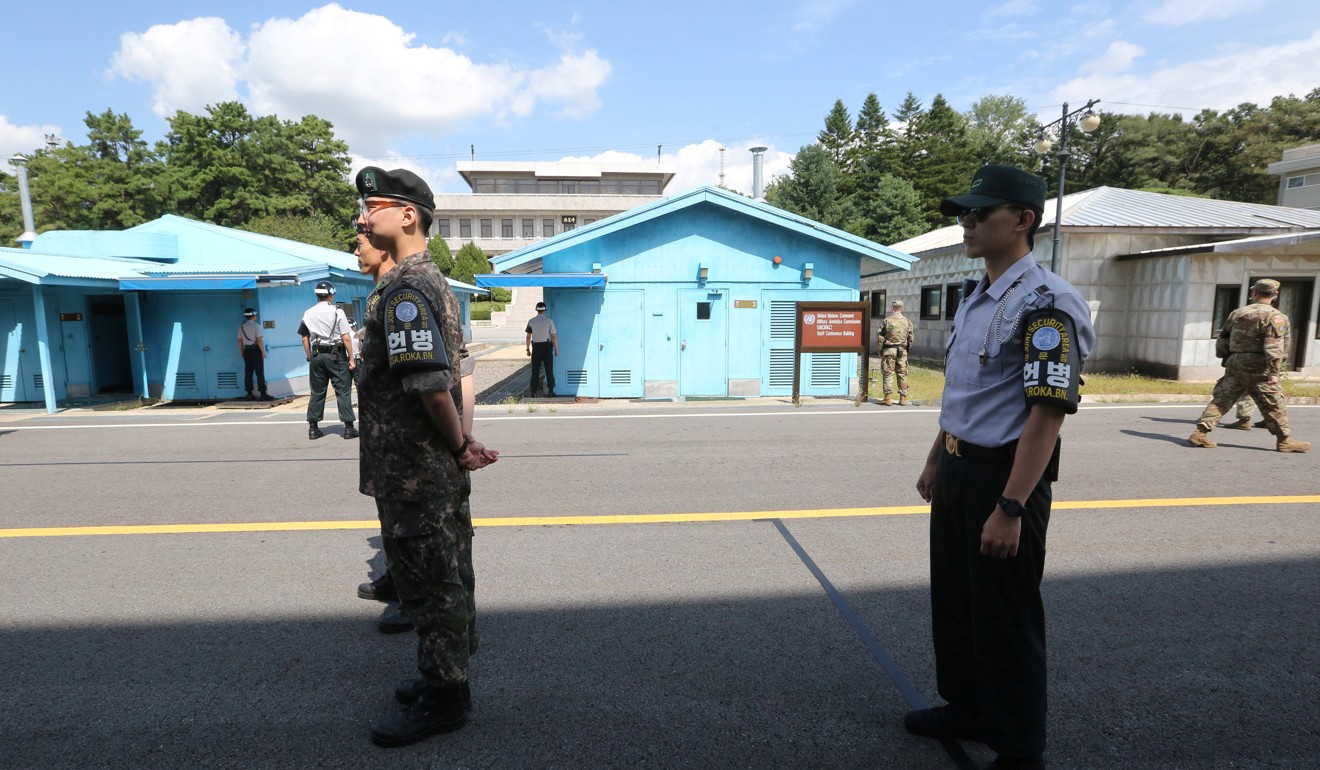 South Korean soldiers stand guard at the border village of Panmunjom in the demilitarised zone. Photo: Reuters