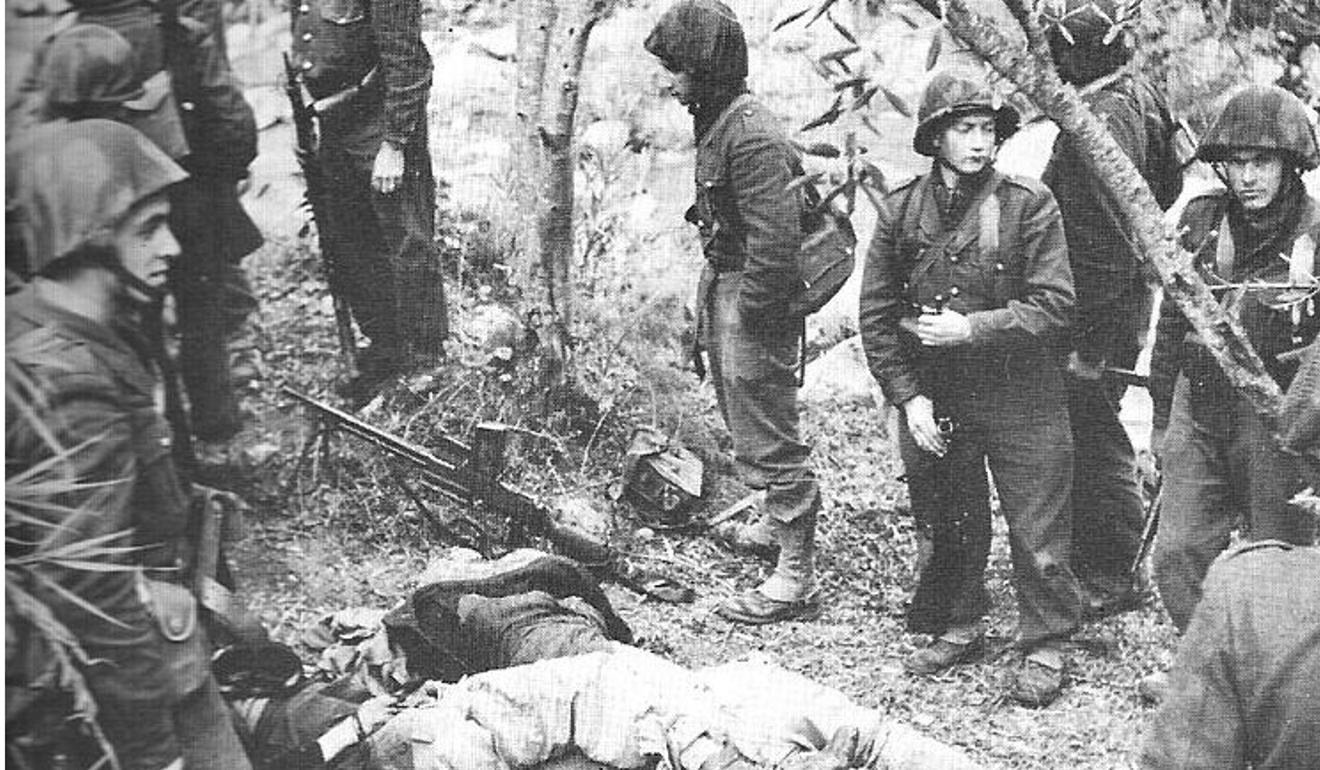 French soldiers with the bodies of Algerian rebels in 1954. Photo: Wikipedia