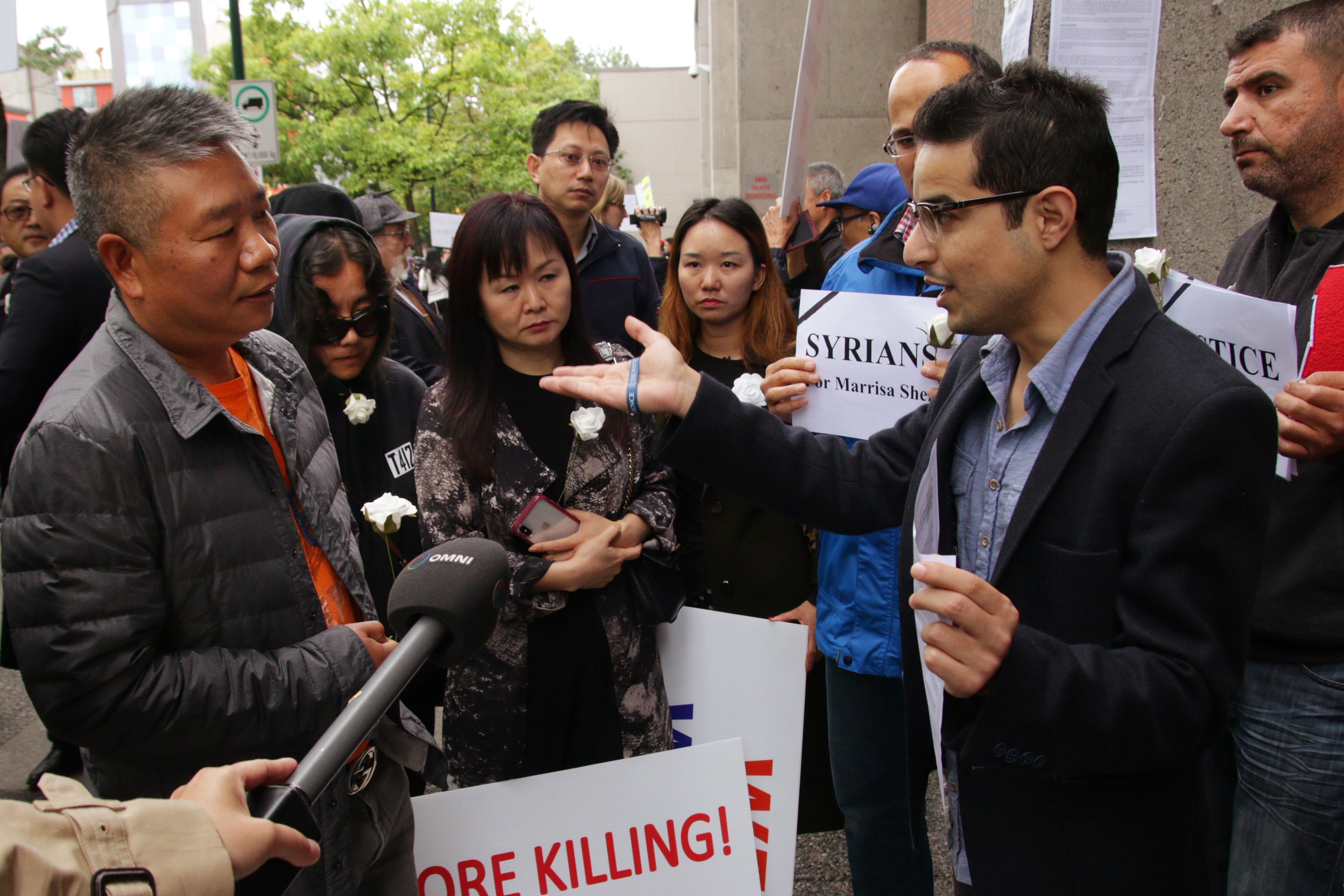 Canadians of Chinese and Syrian descent speak outside the Vancouver courthouse on Friday. Photo: Rob Kruyt/SCMP
