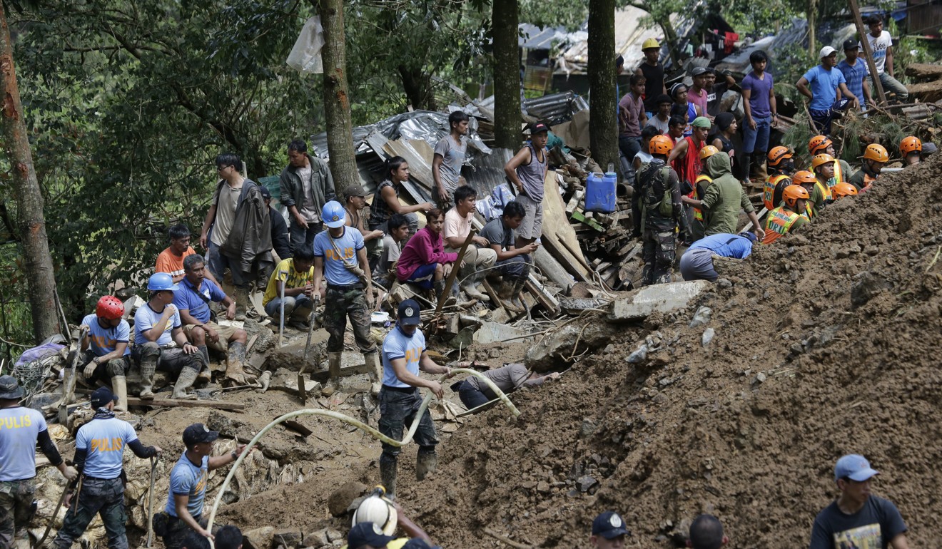 Rescuers search for people believed to have been buried by a landslide in Itogon in the northern Philippines on Monday, September 17, 2018. Photo: AP