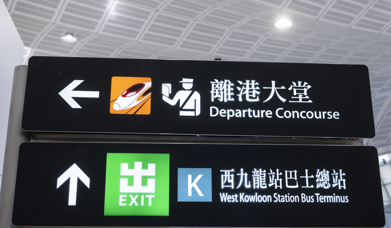 Signs for the Departure Concourse and West Kowloon Station Bus Terminus stand inside West Kowloon Station in Hong Kong, which houses the terminal for the Guangzhou-Shenzhen-Hong Kong Express Rail Link, developed by MTR Corp. The world’s longest high-speed rail network will extend to Hong Kong on September 23. Photo: Bloomberg