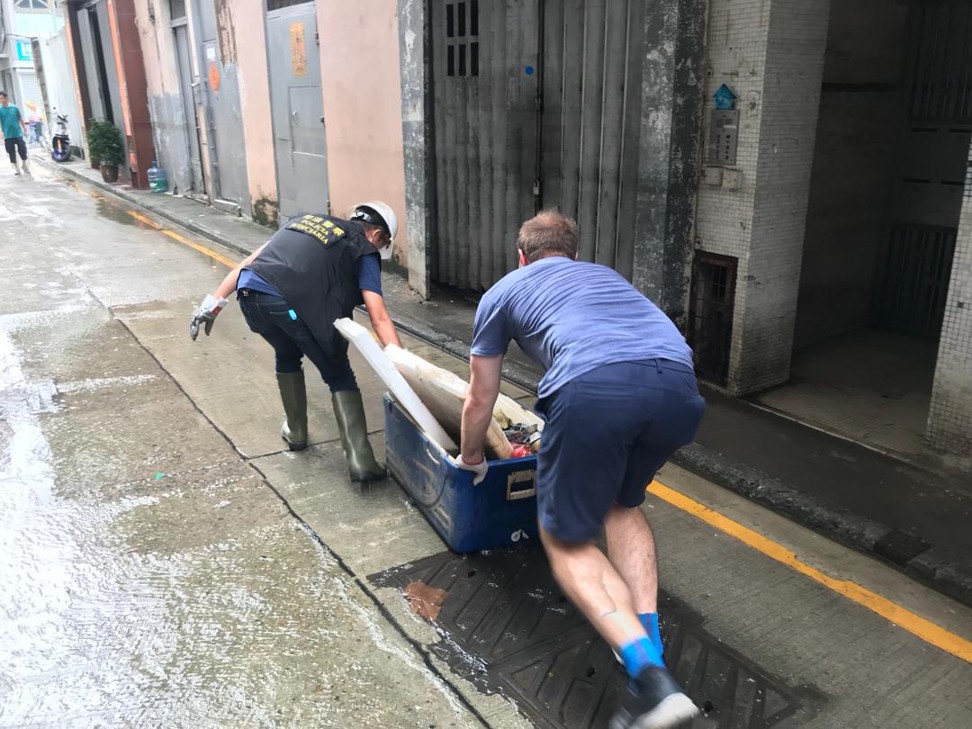 Asia League staff help clean up Typhoon Mangkhut damage in Macau.