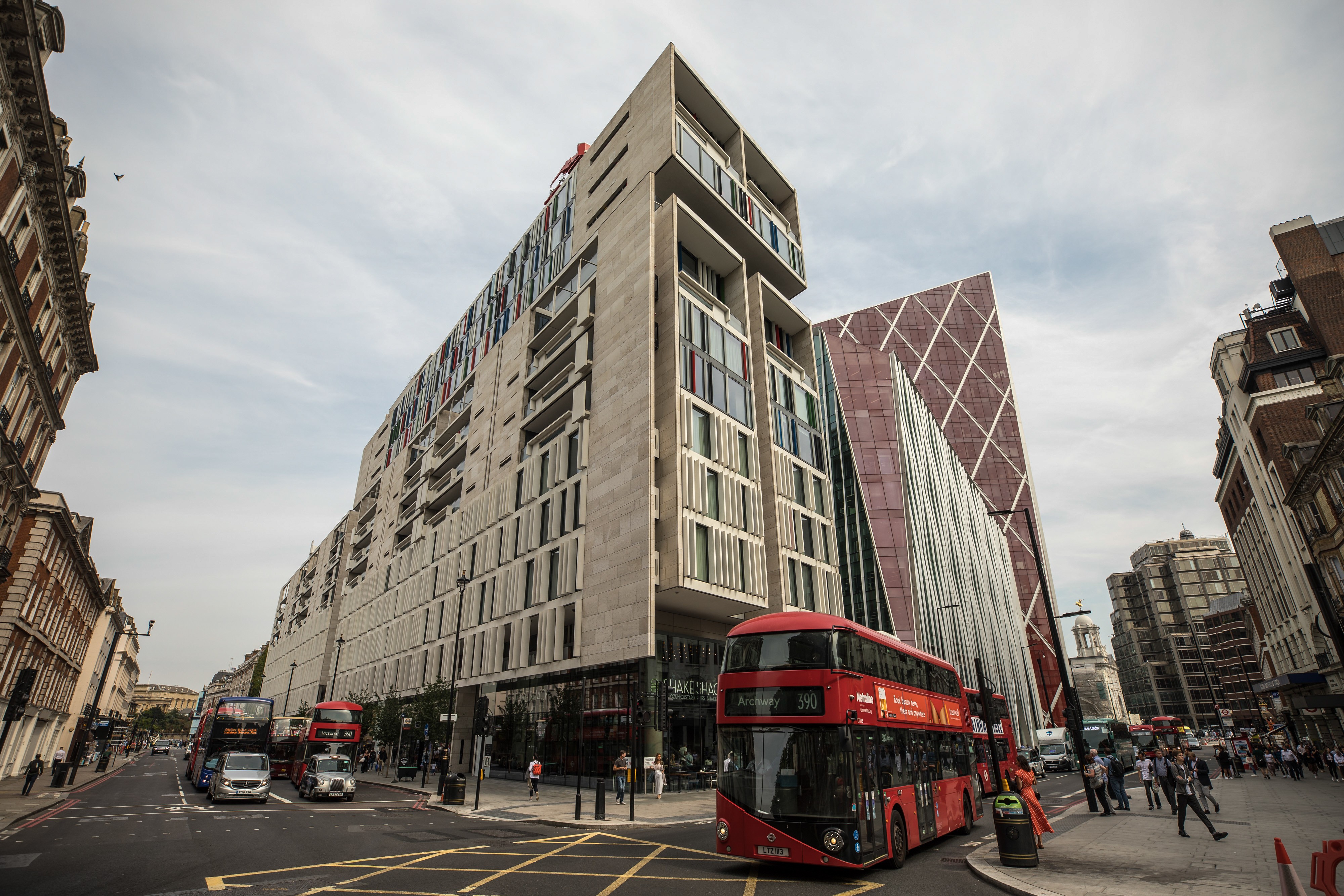 A bus passes The Nova Building, a mixed residential and commercial use building, in the Westminster borough of London. Jitters surrounding the British capital city's property market are finally starting to show up in home prices, but for many young people, buying their own home outright is still out of reach financially, and co-living as a concept is gaining in popularity as a result. Photo: Bloomberg