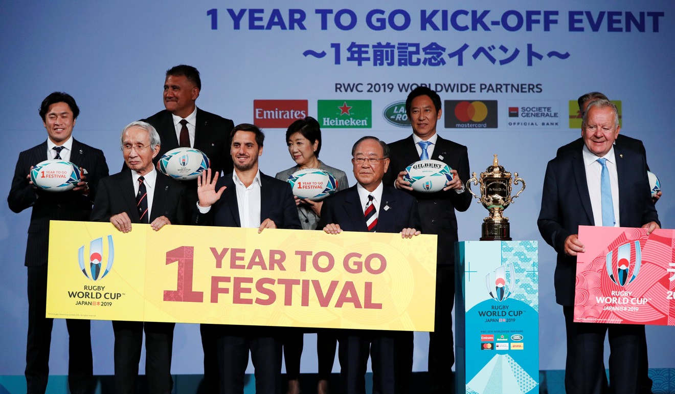 World Rugby chairman Bill Beaumont, chairman of the Rugby World Cup 2019 Organising Committee Fijio Mitarai, president of the Japan Rugby Football Union Tadashi Okamura, Tokyo governor Yuriko Koike, Japan national team head coach Jamie Joseph and other officials pose for a photograph during a kick-off event to mark one year to go to the Rugby World Cup 2019, in Tokyo. Photo: Reuters
