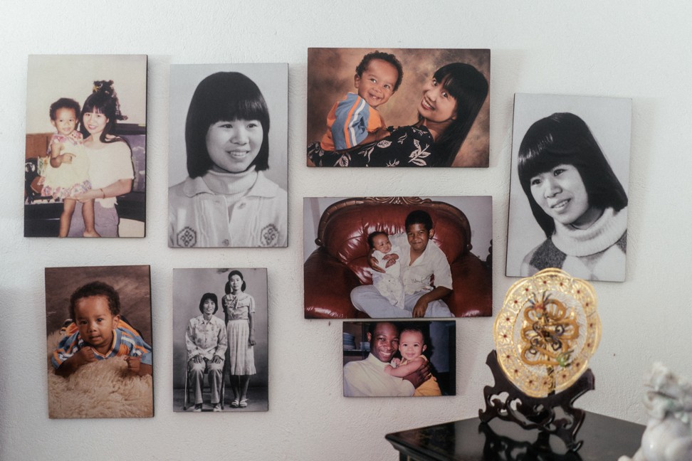 Family photos take pride of place inside Sooma and Wang’s home in Entebbe.