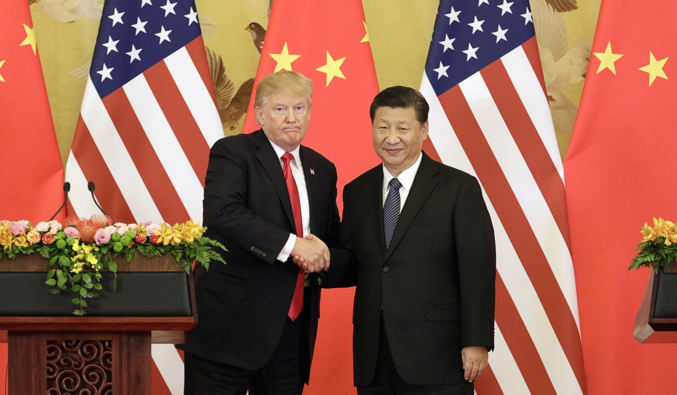 US President Donald Trump and Chinese President Xi Jinping shake hands during a news conference at the Great Hall of the People in Beijing on November 9, 2017. Photo: Bloomberg