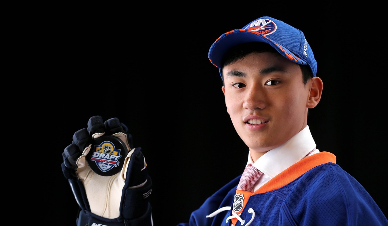 Song Andong poses after being selected 172nd overall by the New York Islanders during the 2015 NHL Draft. Photo: AFP