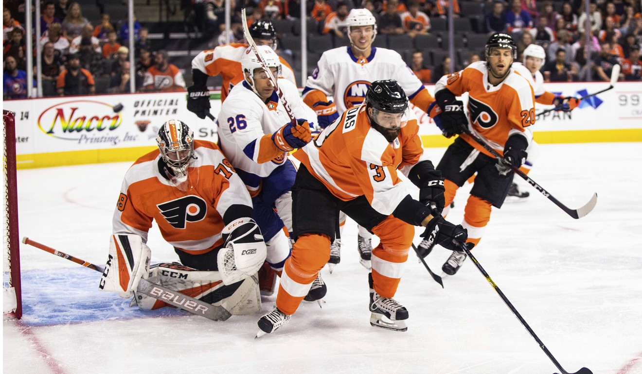 New York Islanders Josh Ho-sang (centre left) gives chase during the first period of a pre-season NHL hockey game last week. Photo: AP