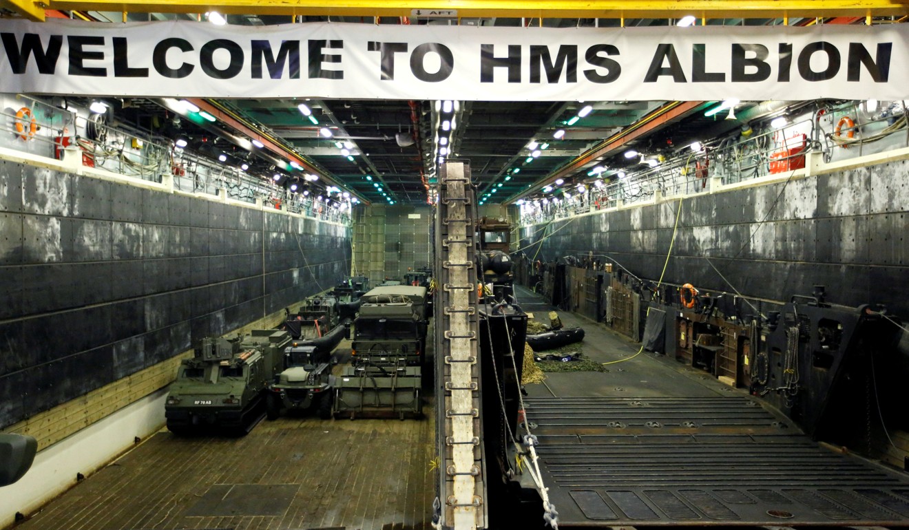 Military vehicles in the loading dock of the HMS Albion at Harumi Pier in Tokyo in August, 2018. Photo: Reuters