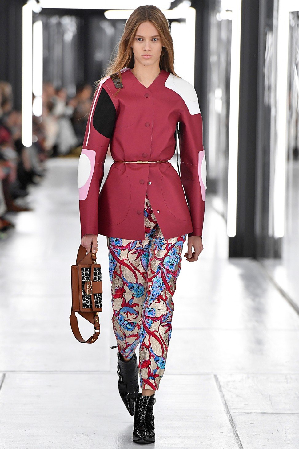 A model displays a creation by designer Nicolas Ghesquiere for Louis  Vuitton Fall-Winter 2014/2015 Ready-To-Wear collection show held at Cour  Carree du Louvre in Paris, France, on March 05, 2014. Photo by