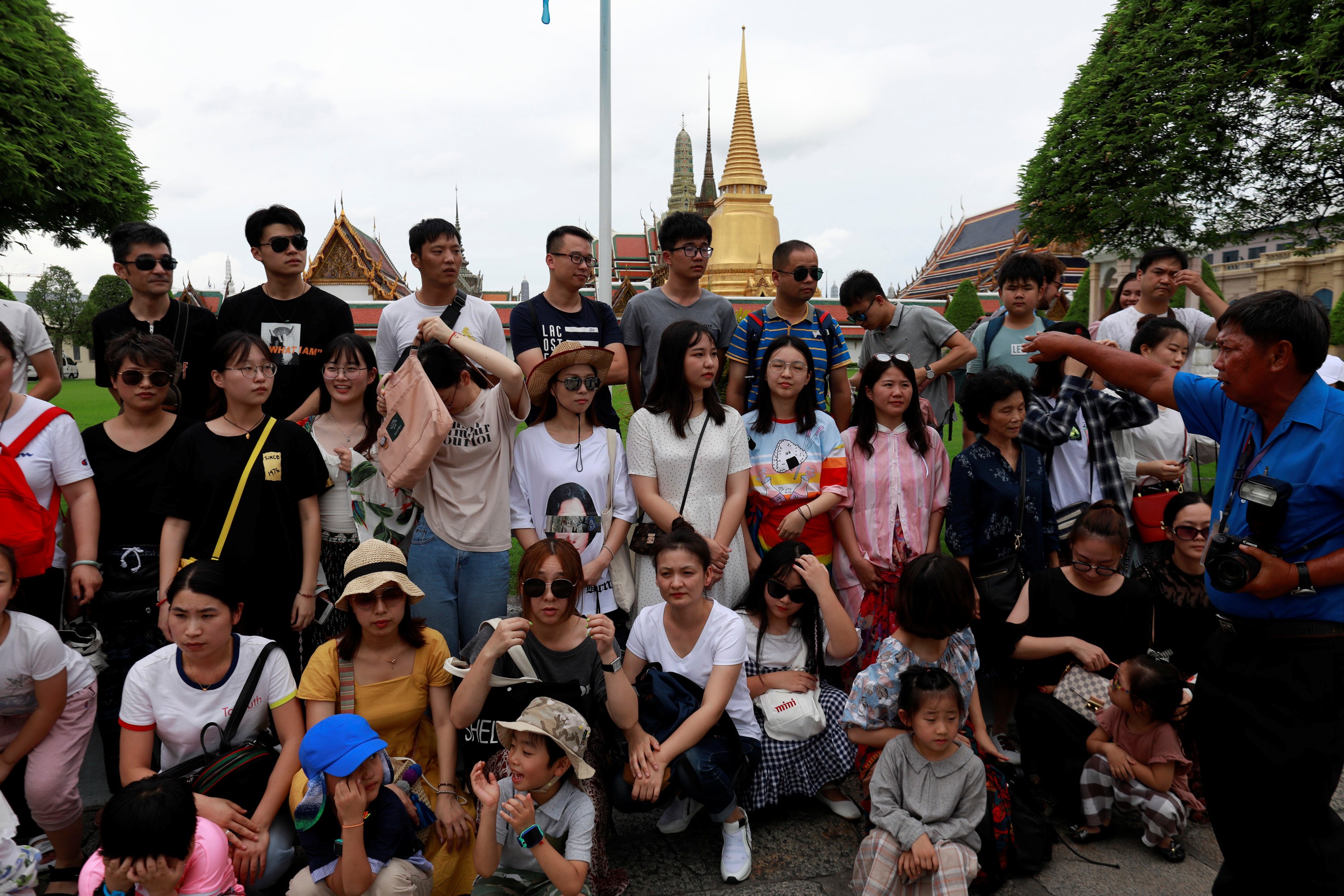 A group of Chinese tourists at the Temple of the Emerald Buddha in Bangkok, in August 2018. Picture: Reuters