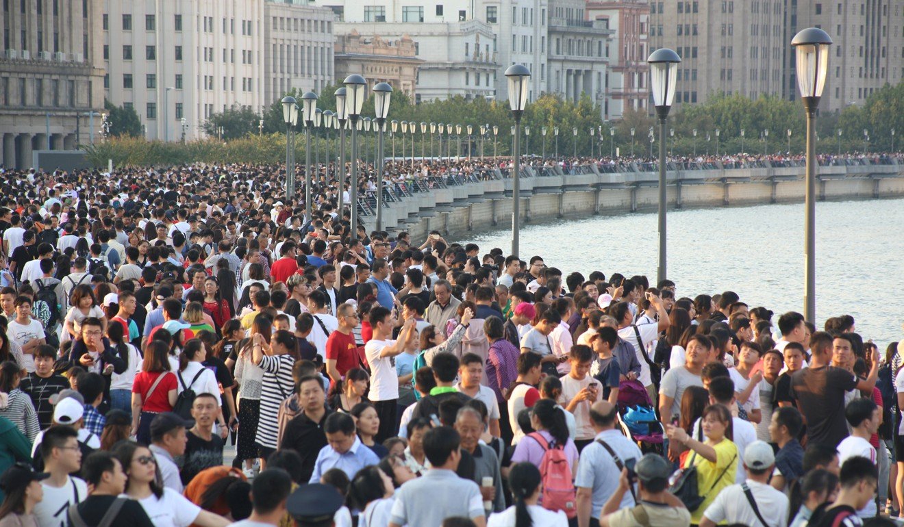 Visitors throng the Bund, Shanghai’s iconic waterfront, on October 2, the second day of the Golden Week holiday. New home sales in Shanghai were surprisingly strong compared to most cities, rising 243 per cent from a year earlier. Photo: Reuters
