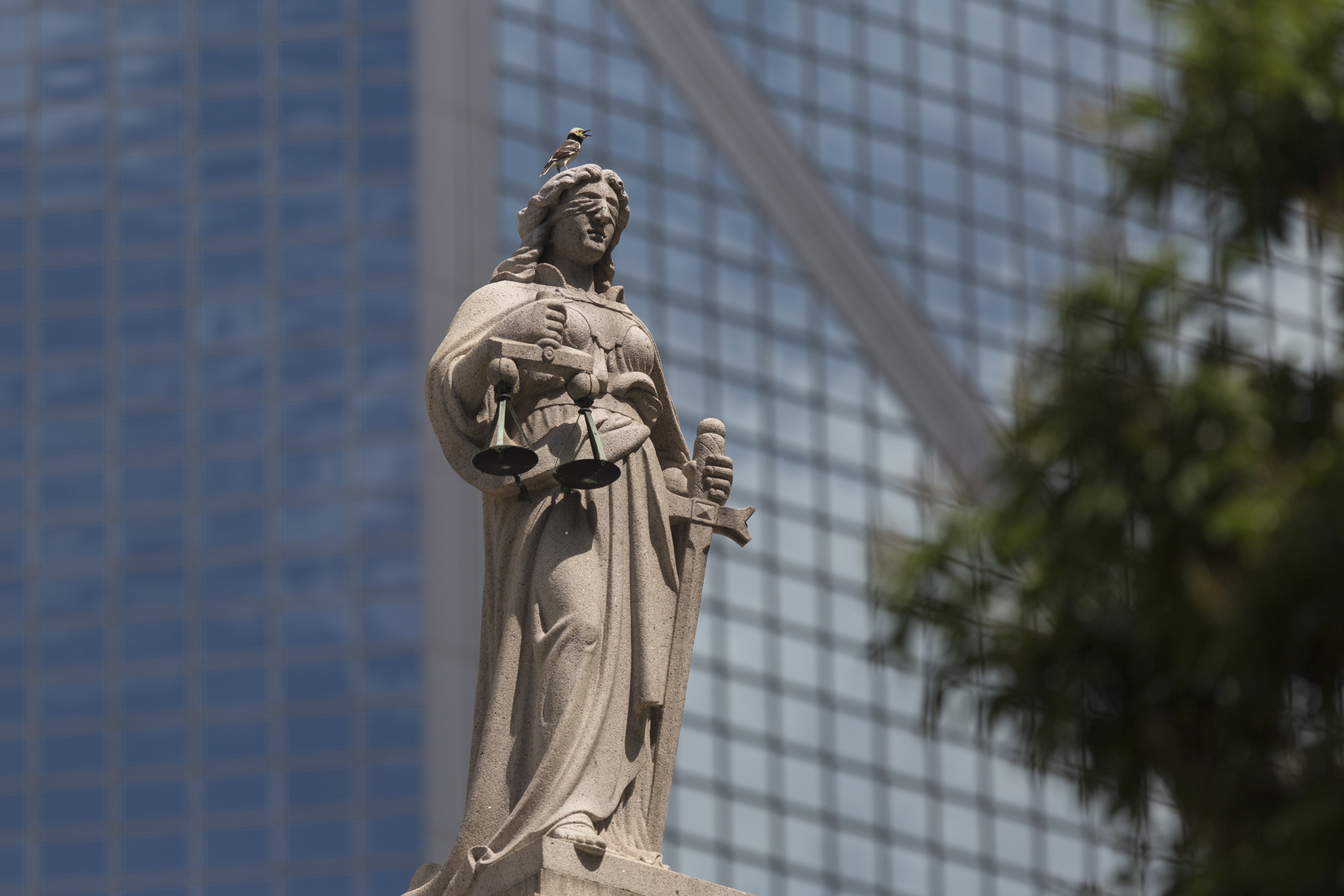 A statue representing Justice is displayed on the Court of Final Appeal in Hong Kong. Photo: EPA