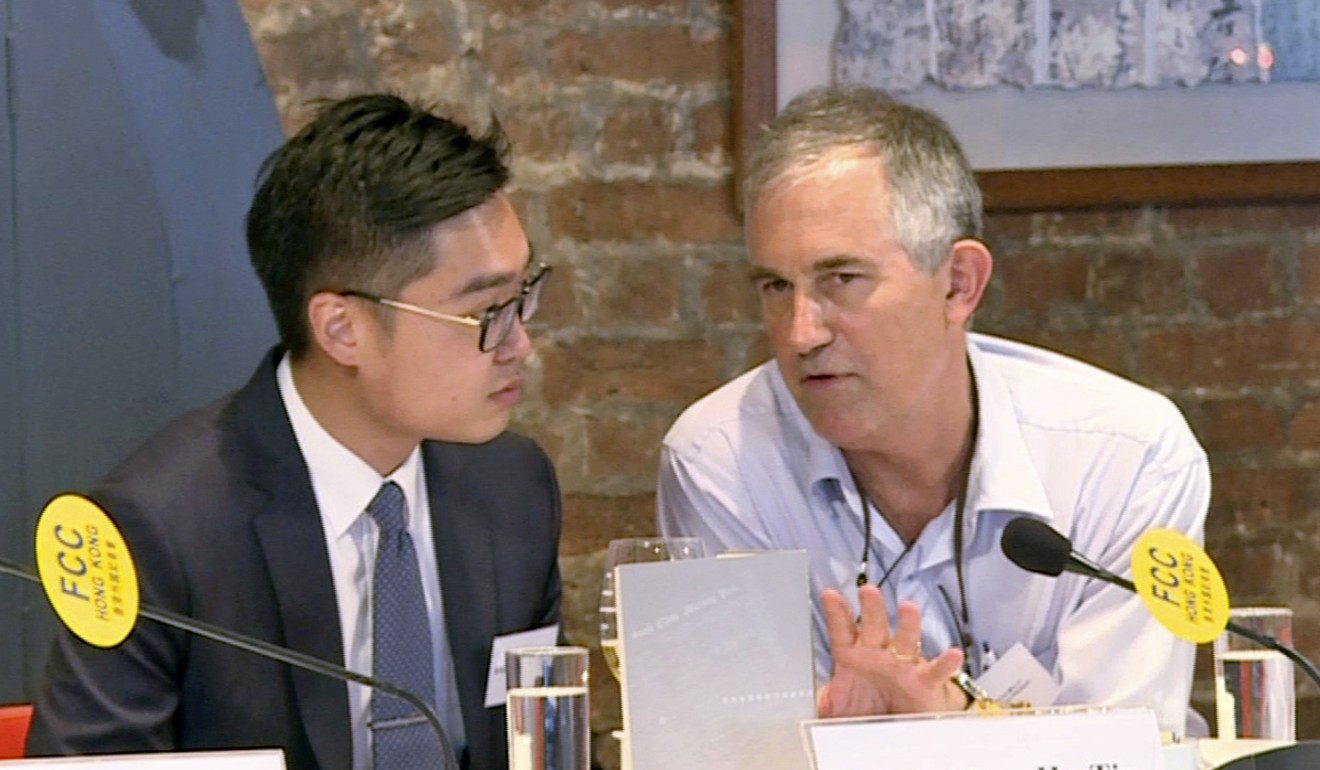 Andy Chan, founder of the Hong Kong National Party, talks to Financial Times Asia news editor, Victor Mallet during a lunch at the Foreign Correspondents Club in Hong Kong in August. Photo: AP
