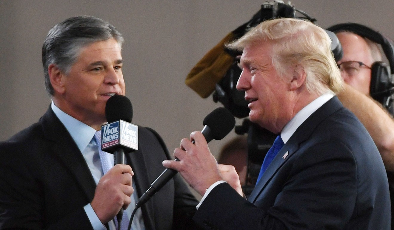 ]Fox News Channel and radio talk show host Sean Hannity interviews US President Donald Trump before a rally in Las Vegas. Photo: AFP