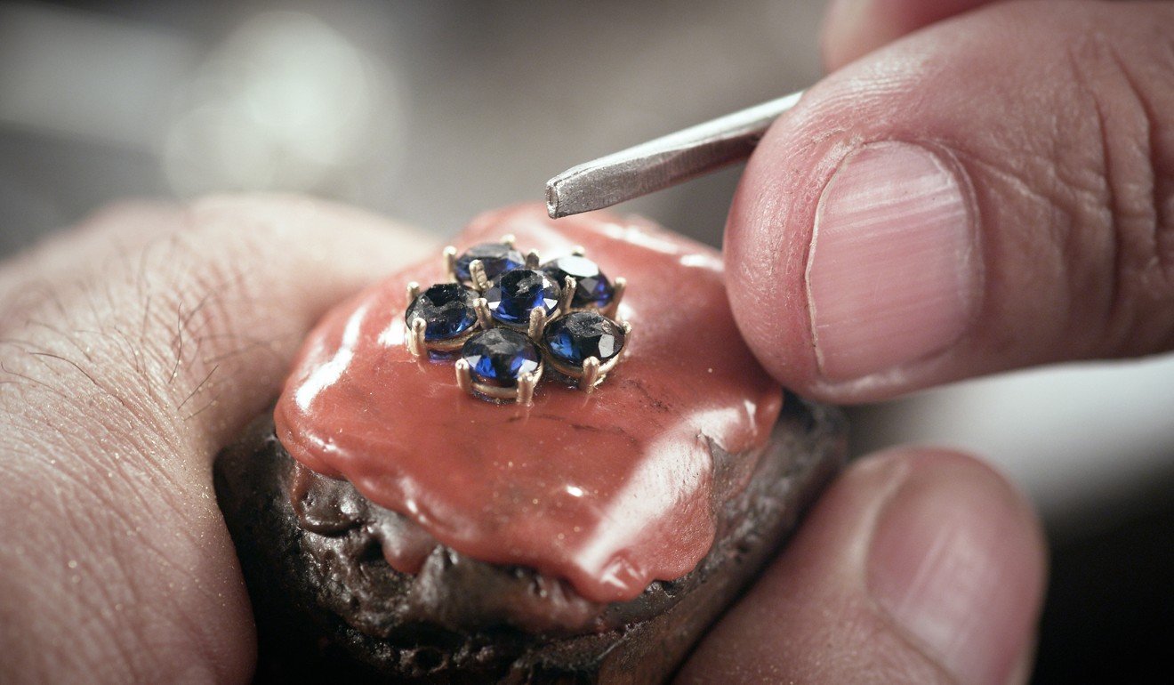 Mounting stones on a piece in the Mouawad atelier.