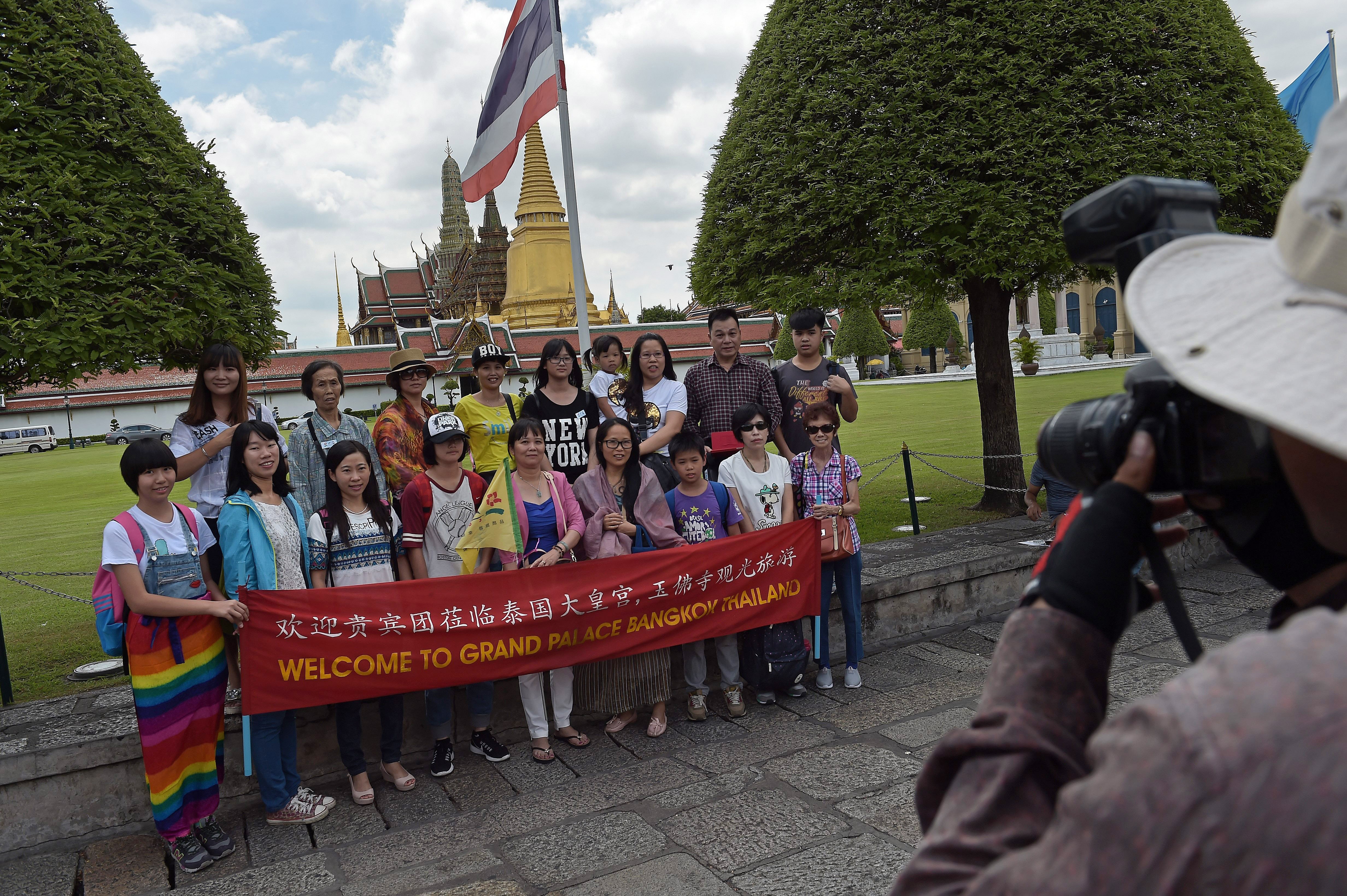 A Chinese tour group in front of Bangkok’s Grand Palace. Photo: AFP