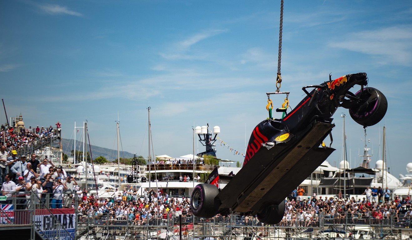 Red Bull driver Max Verstappen’s car is lifted from the track by a crane after he crashed during qualifying for the Monaco Grand Prix in 2016. Photo: AP