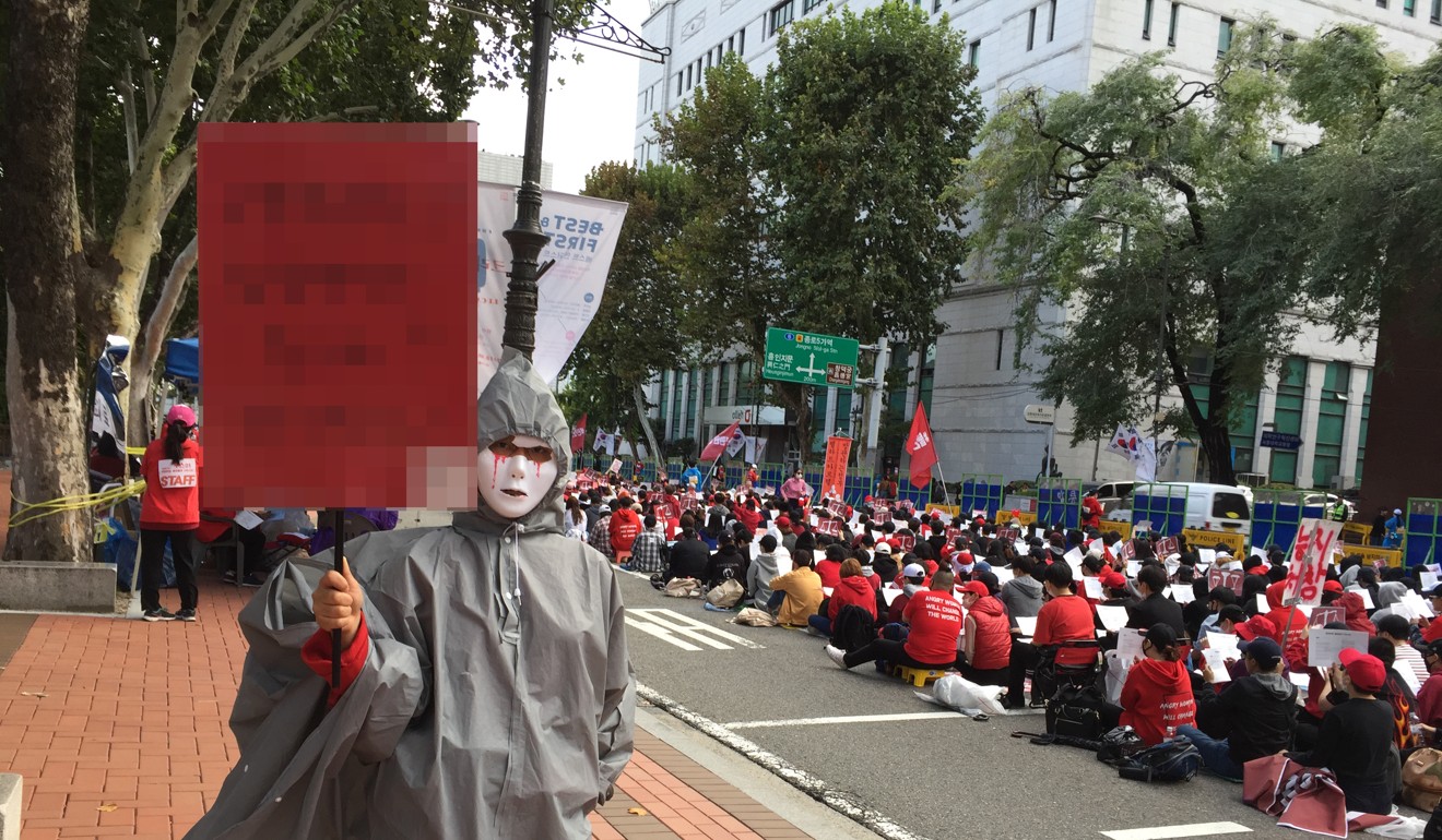 Women protesting against hidden camera pornography in Seoul, South Korea, on October 6, 2018. The sign is mosaiced to obscure a word some may find offensive. Photo: SCMP/Crystal Tai