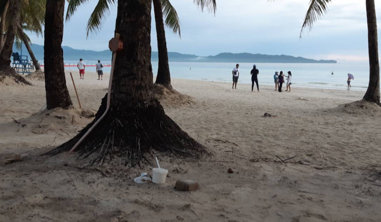 A few hours into Boracay's “soft opening” and rubbish is spotted on White Beach. Picture: Twitter / @cnnphilippines