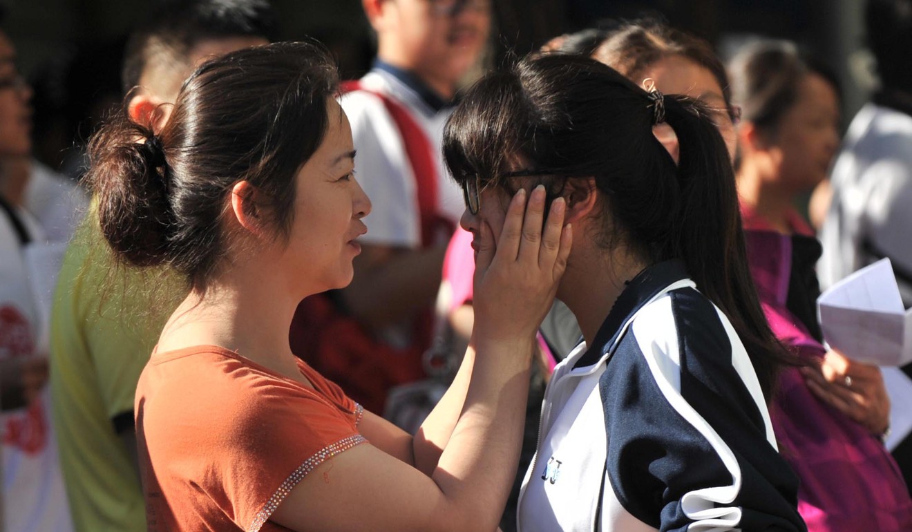 Words of encouragement before the national entrance exam. Chinese parents understand how intense the competition is for university places. Photo: Xinhua