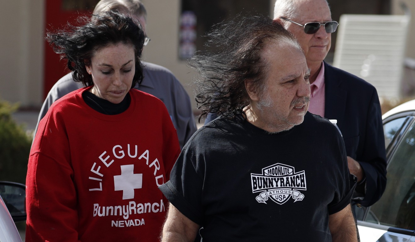 Ron Jeremy, front right, and Heidi Fleiss, left, walk out of the Love Ranch brothel. Photo: AP