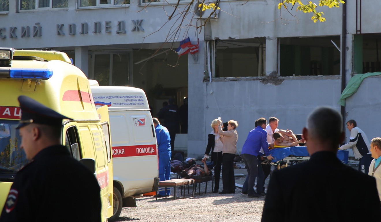 Rescuers work outside the college in Kerch. Photo: EPA
