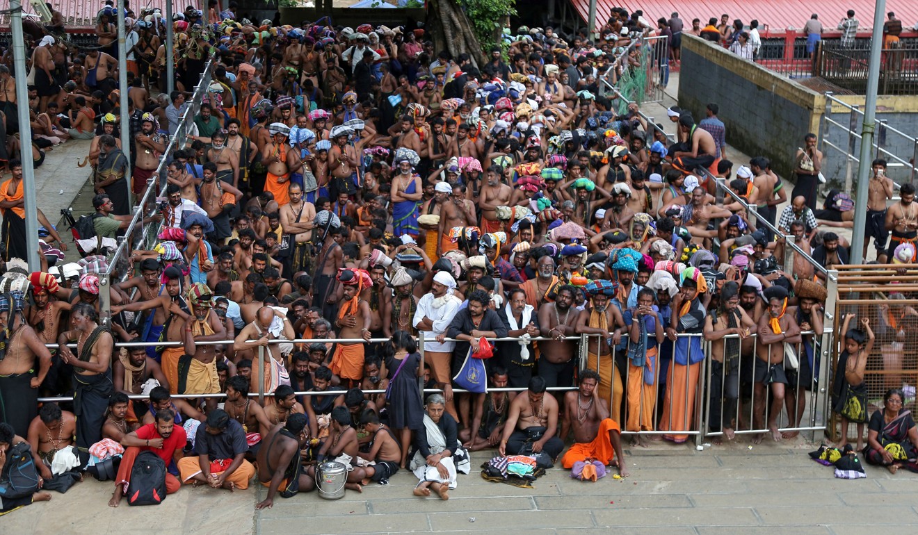 Hindu devotees wait inside the premises of the Sabarimala temple on Wednesday. Photo: Reuters