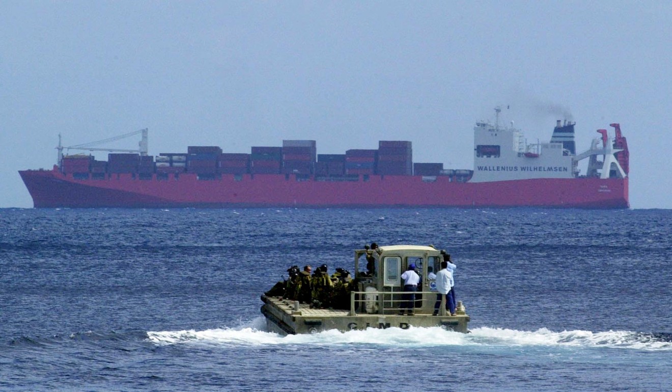 A boat carrying Australian SAS soldiers heads toward the Norwegian ship Tampa, carrying more than 400 Afghan and Sri Lankan refugees, in 2001. Photo: AFP