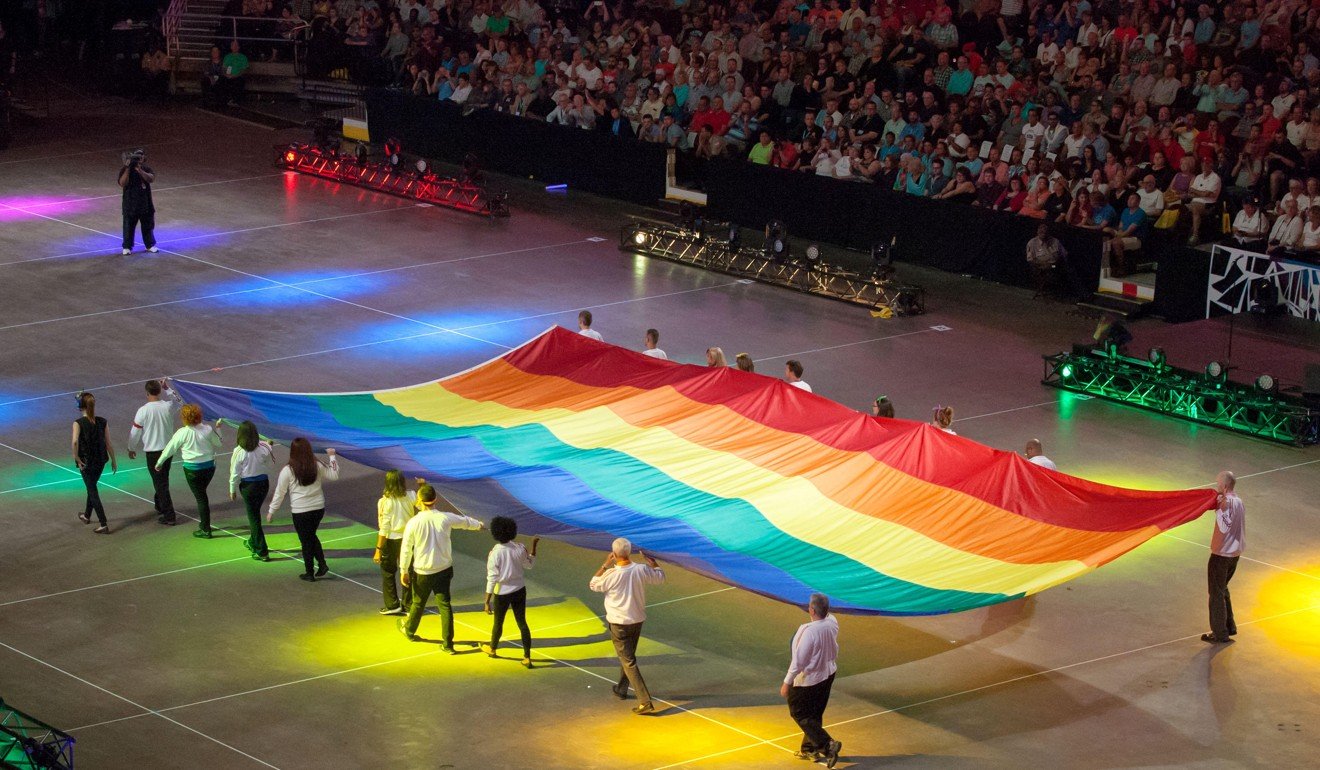 The Rainbow Flag is presented at the opening ceremony of the 2014 Gay Games at Quicken Loans Arena in Cleveland, Ohio, the US. Photo: Alamy