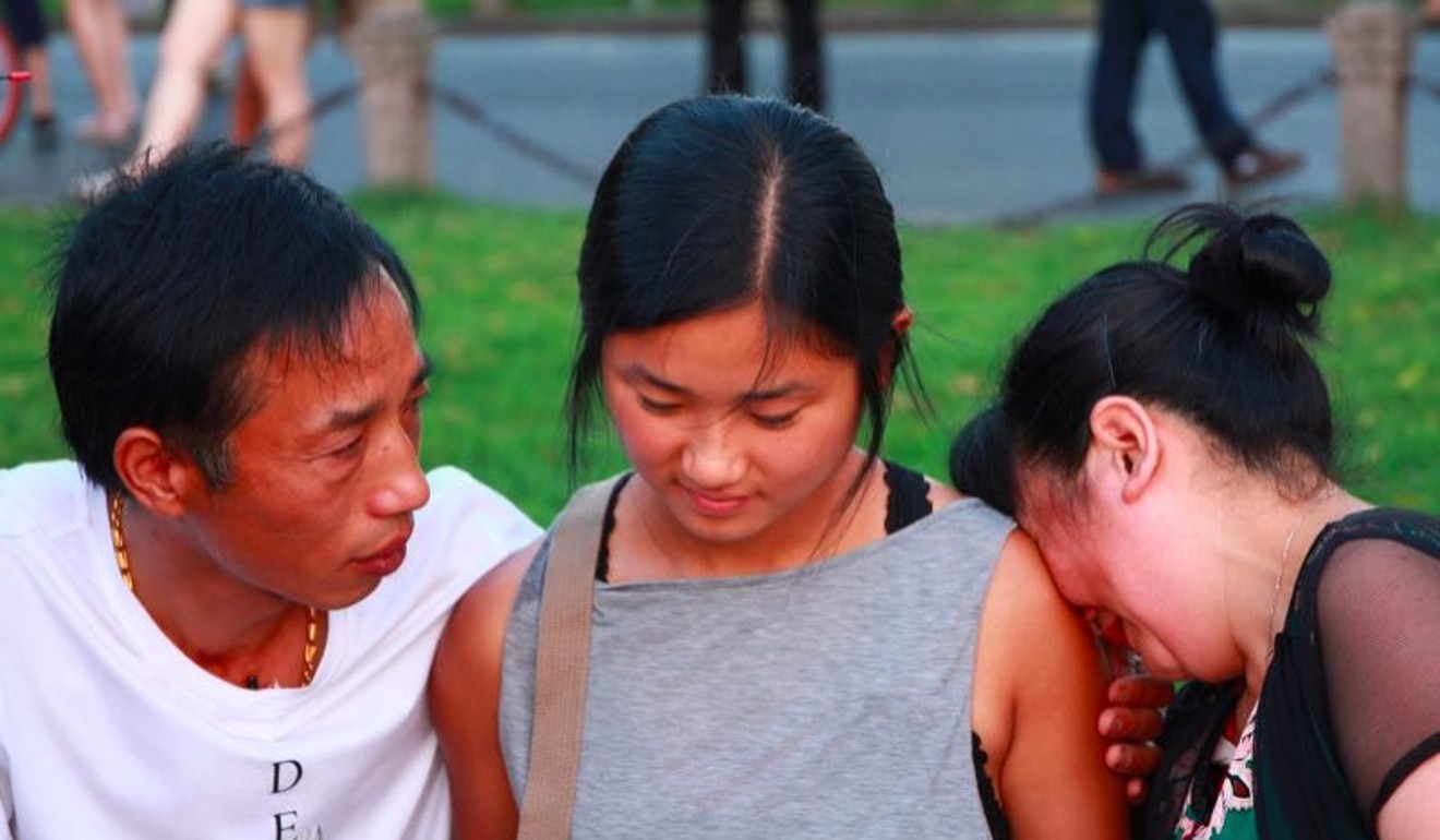 Kati reunites with her birth parents, Xu Lida (left) and Qian Fengxiang, on Hangzhou’s Broken Bridge, nearly 22 years after they gave her up. Picture: courtesy of Kati Pohler