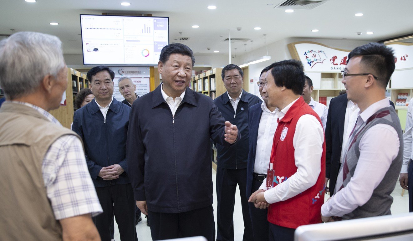 Xi Jinping meets social workers and residents of the Beizhan community in the Longhua district of Shenzhen on Wednesday. Photo: Xinhua