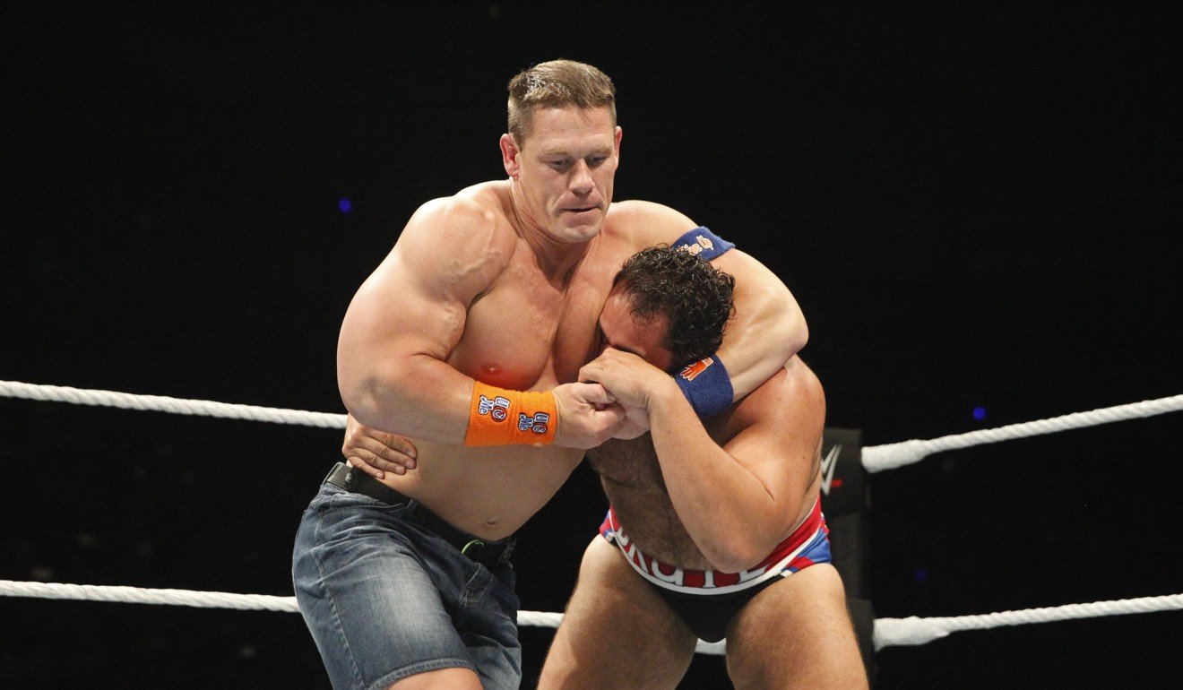 John Cena grapples with Rusev at WWE Shenzhen Live in 2017. Photo: WWE
