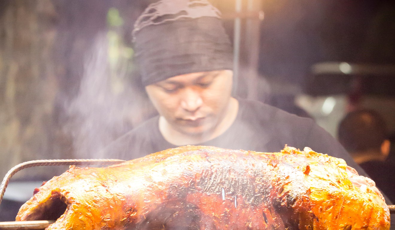 A chef at work in Bukit Bintang, a famous destination in Kuala Lumpur for street food. Photo: Alamy