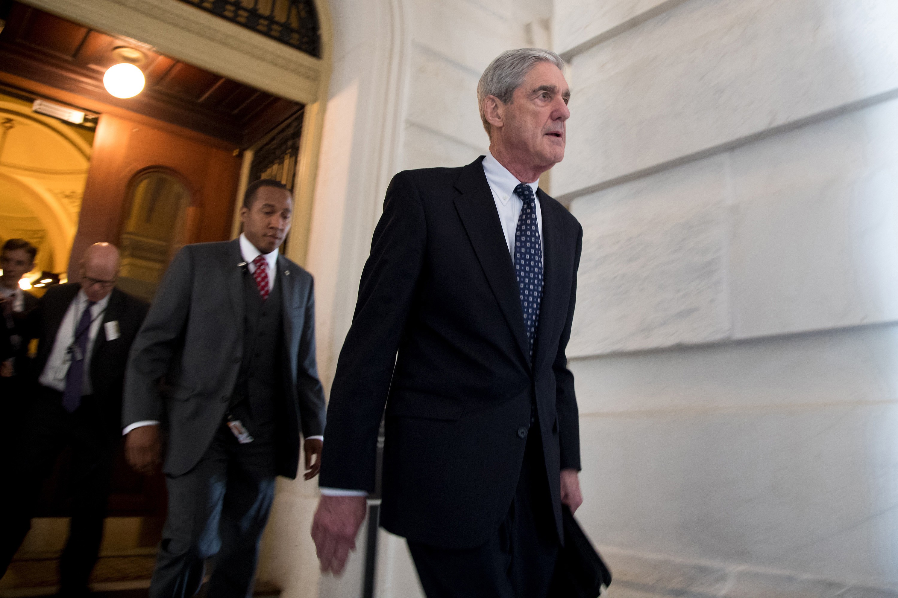 Robert Mueller, front, the special counsel probing Russian interference in the 2016 US election, leaves the Capitol building after meeting with the Senate Judiciary Committee on Capitol Hill on June 21, 2017. Photo: TNS