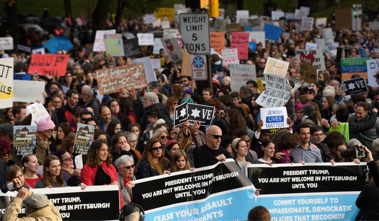 An estimated 4,000 people gathered to pay tribute to victims of the Pittsburgh synagogue shootings, and protest against a visit by US President Donald Trump on Tuesday. Photo: Agence France-Presse