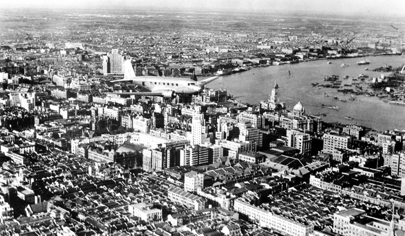Aerial view of Shanghai International Settlement and the Huangpu river, 1937. At the tail of the plane is the Broadway Mansion at the limit of the American Settlement. Photo: Keystone