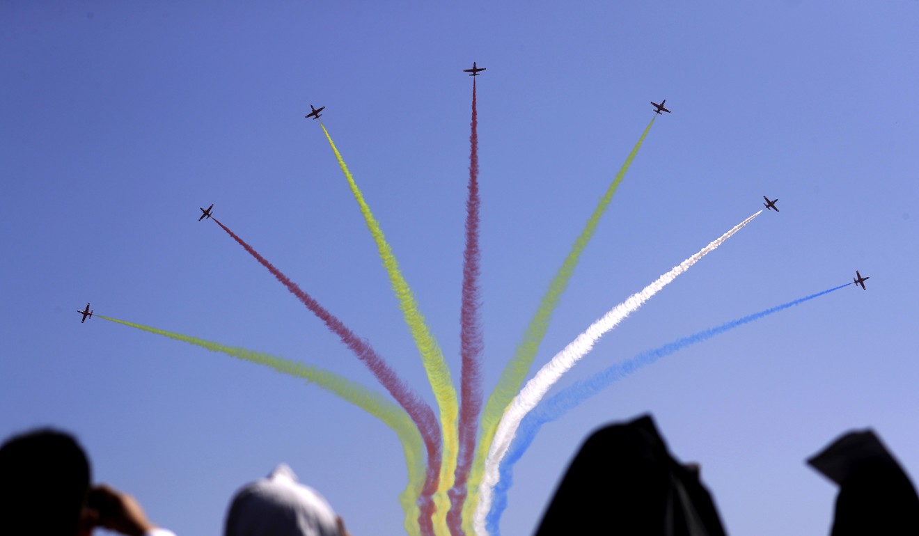 Spectators watch a display from China’s Red Eagles aerial display team. Photo: AP