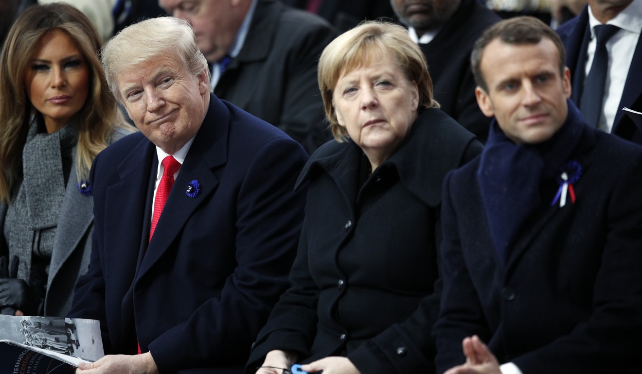 US President Donald Trump, German Chancellor Angela Merkel and French President Emmanuel Macron attend ceremonies at the Arc de Triomphe on Sunday. Photo: AP