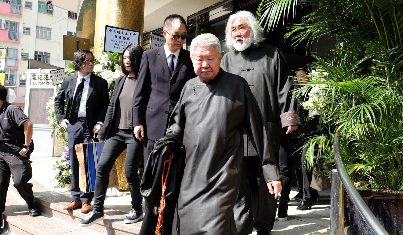 Food writer Chua Lam (front), columnist Benny Li, (back left) and actor Bryan Leung (back right) leave Hong Kong Funeral Home in Quarry Bay after attending the funeral of Louis Cha. Photo: Felix Wong