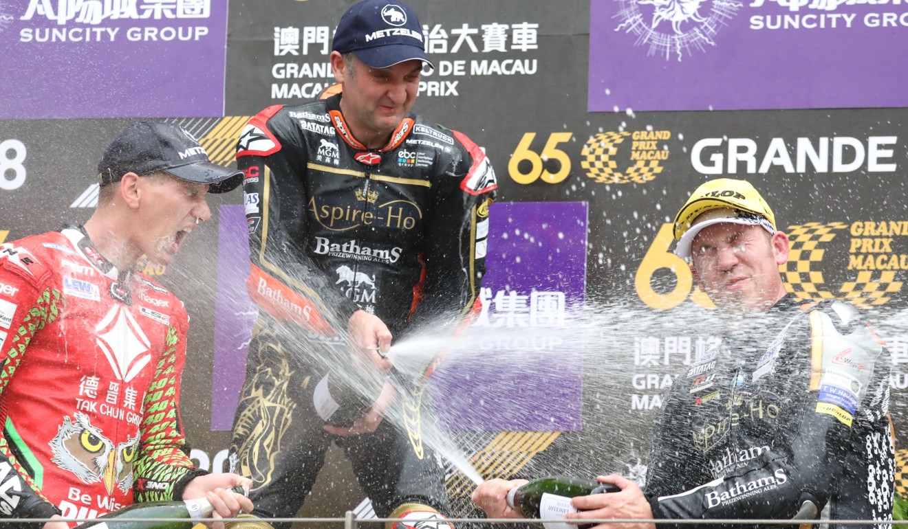 Martin Jessopp (left), Michael Rutter (top) and Peter Hickman spray champagne on the podium. Photo: KY Cheng