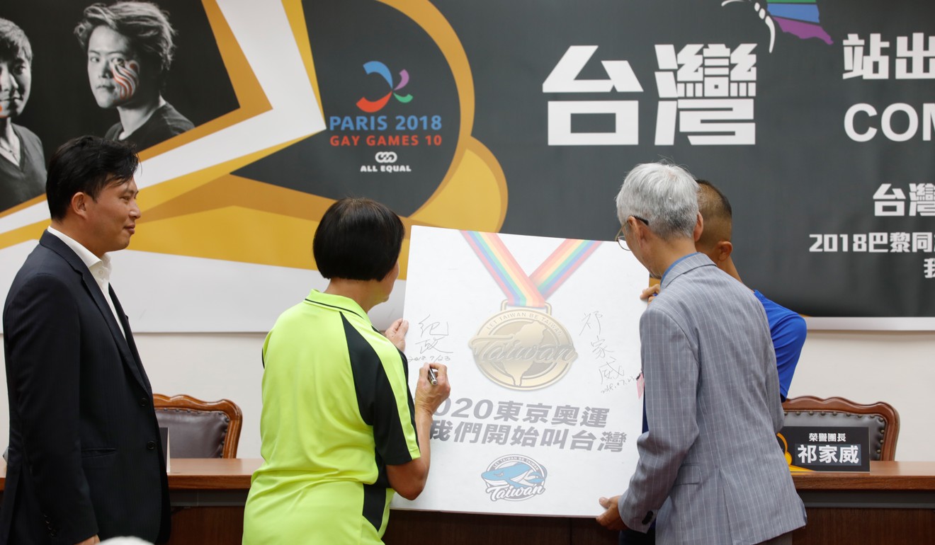 In Taipei in July human rights campaigner Chi Chia-wei (right) joined politician Huang Kuo-chang (left) in signing up for a referendum for Taiwan to compete in the Tokyo 2020 Olympic Games as Taiwanese athletes prepared to take part in August’s Paris 2018 Gay Games. Photo: AFP