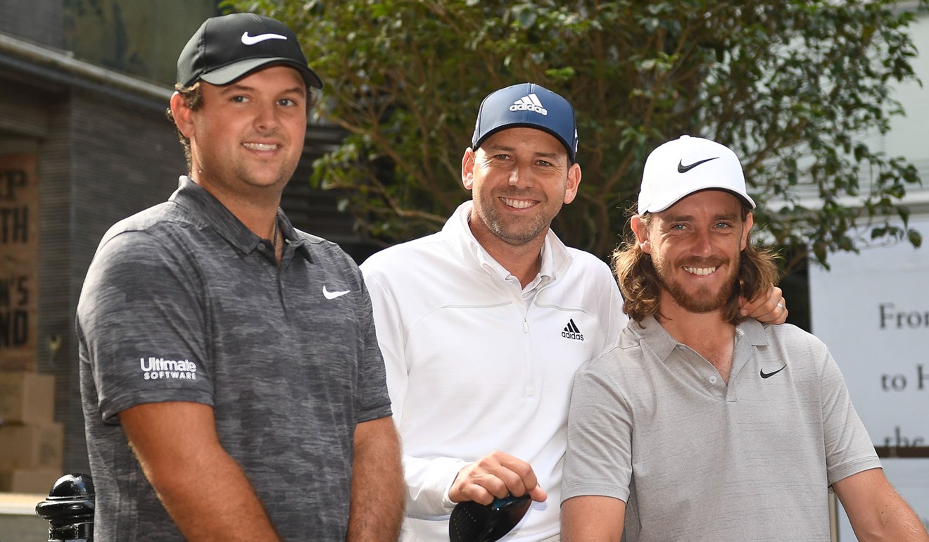 Patrick Reed, Sergio Garcia and Tommy Fleetwood in Pottinger Street, Central, on Tuesday. Photo: Richard Castka