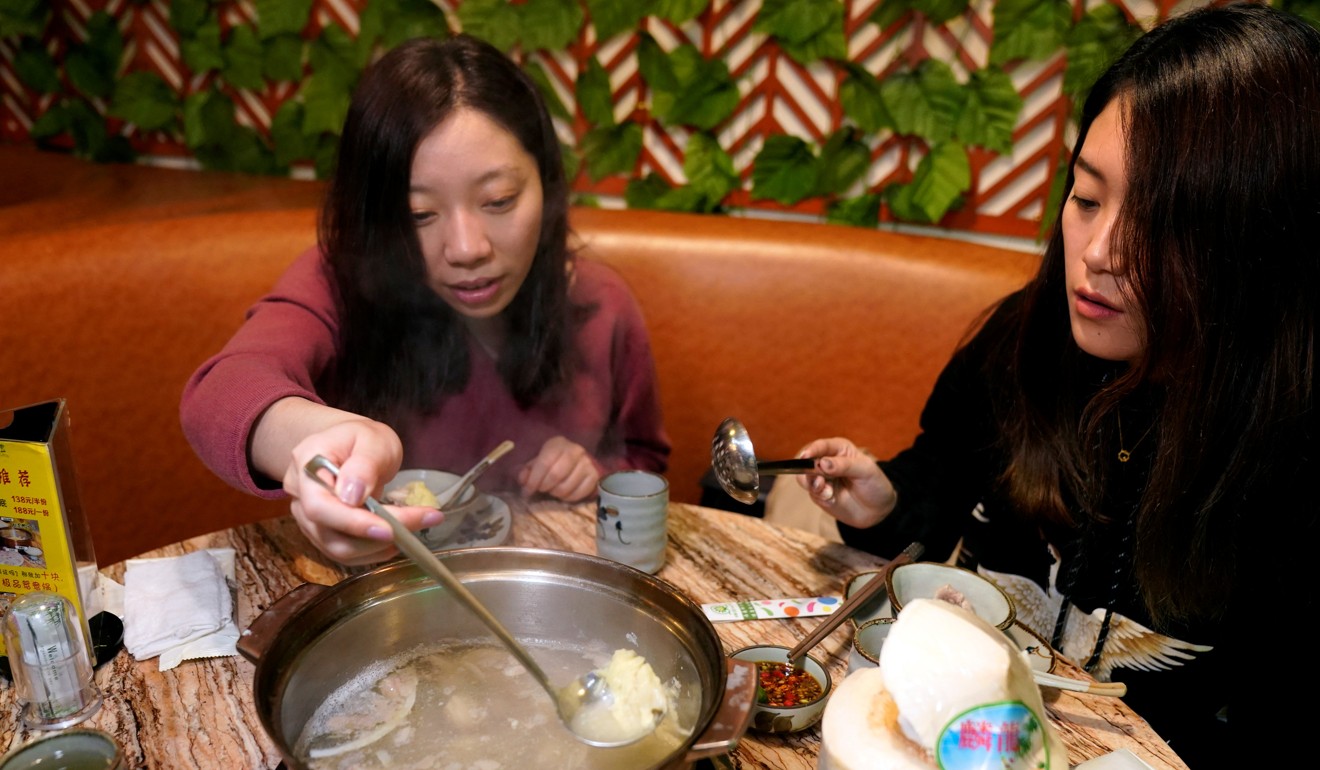 Customers eat a durian hotpot in Shanghai. Image: Reuters