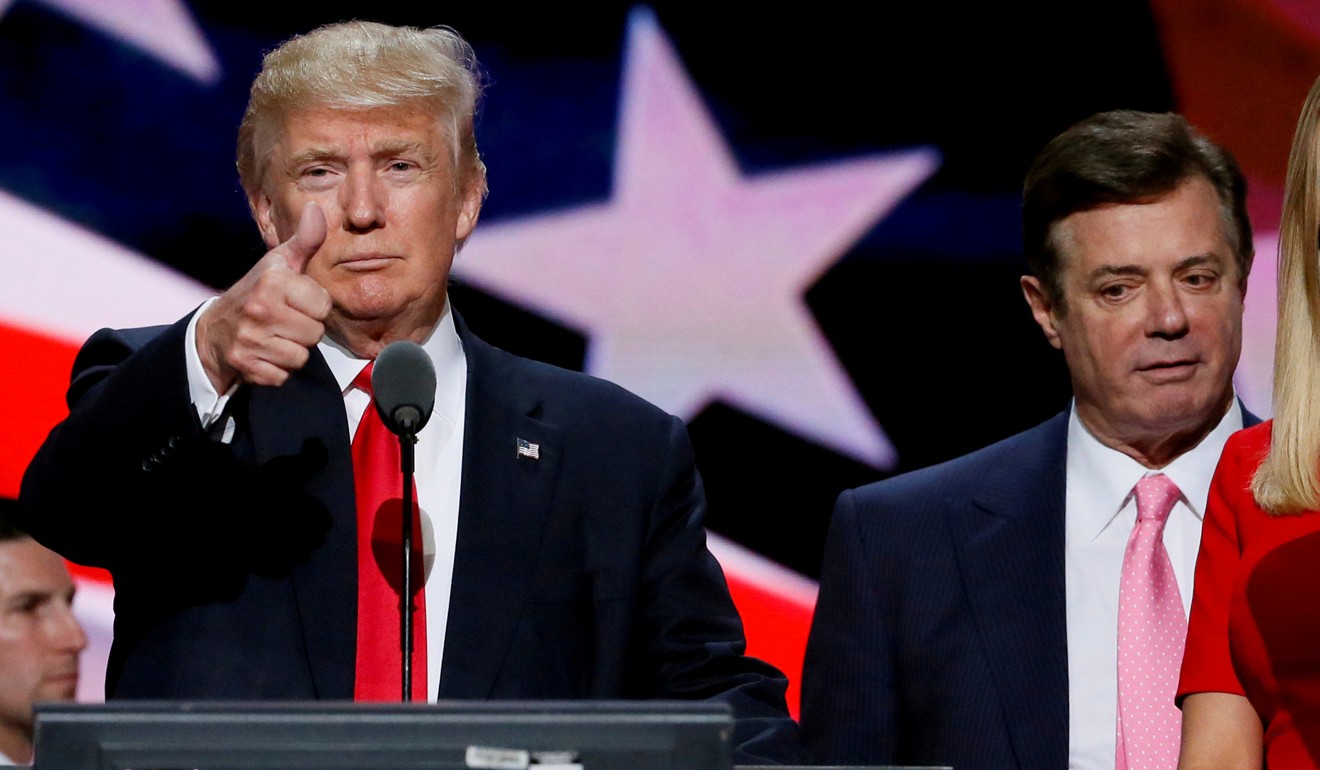 Donald Trump gives a thumbs-up as his campaign manager Paul Manafort looks on at the Republican National Convention in Cleveland on July 21, 2016. Photo: Reuters