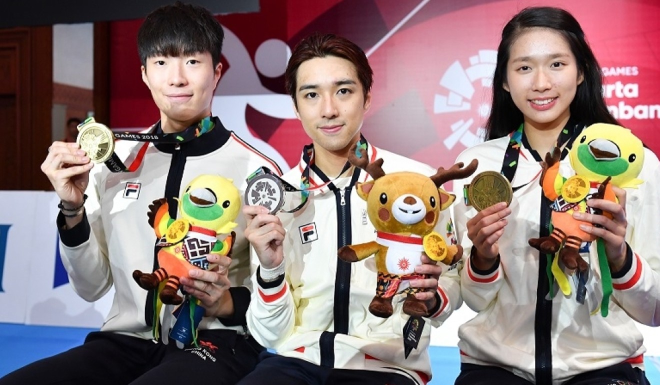 (From left to right) Edgar Cheung, Nicholas Choi, and Vivian Kong show off their Asian Games medals in Jakarta. Photo: HKOC