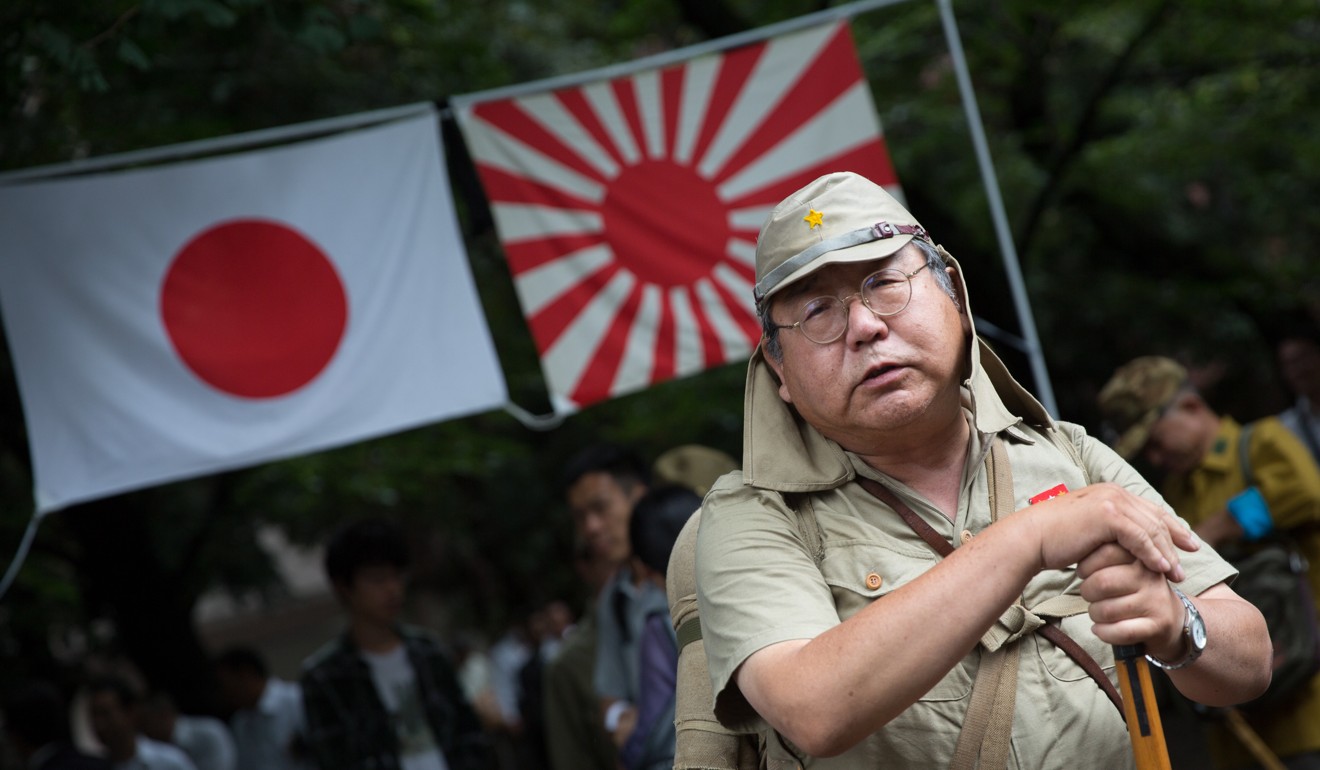 A Japanese man wears an imperial army uniform at the Yasukuni Shrine. Photo: EPA