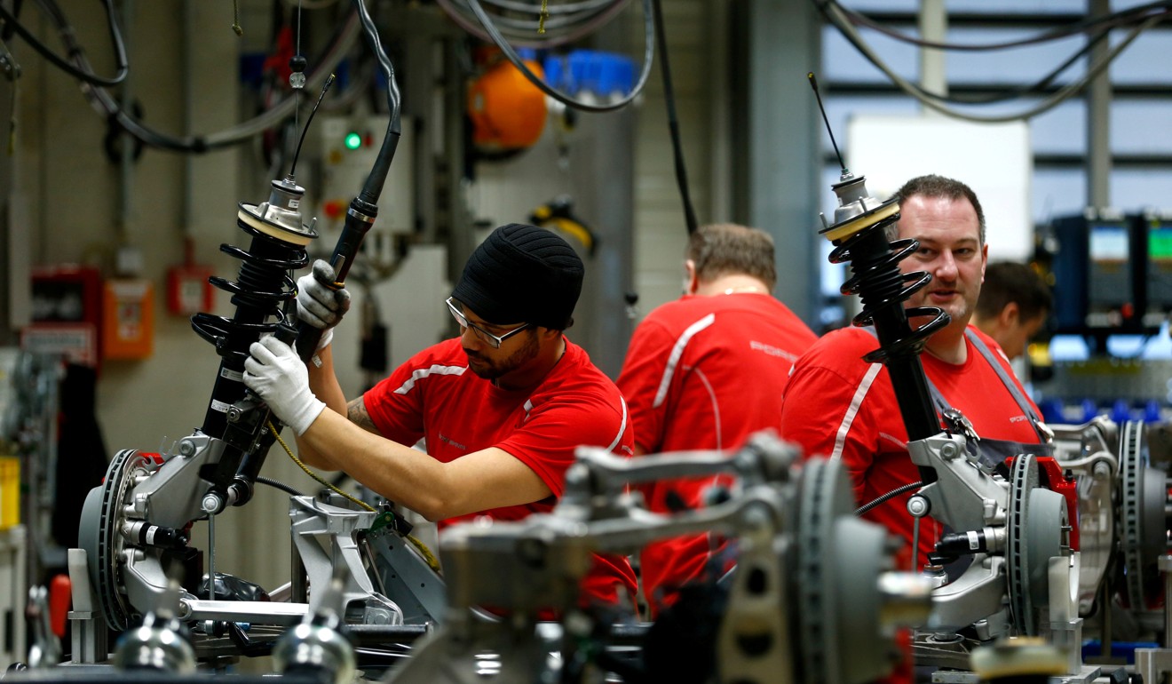 Employees of German car manufacturer Porsche work at the Porsche factory in Stuttgart-Zuffenhausen in January. Despite an uptick in the economy overall, wage growth in Germany declined in 2017. Photo: Reuters